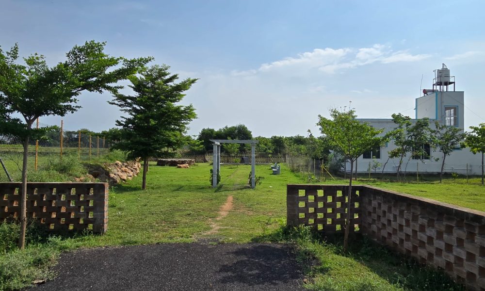 Elegant premium farmhouse surrounded by lush greenery and modern architecture.
